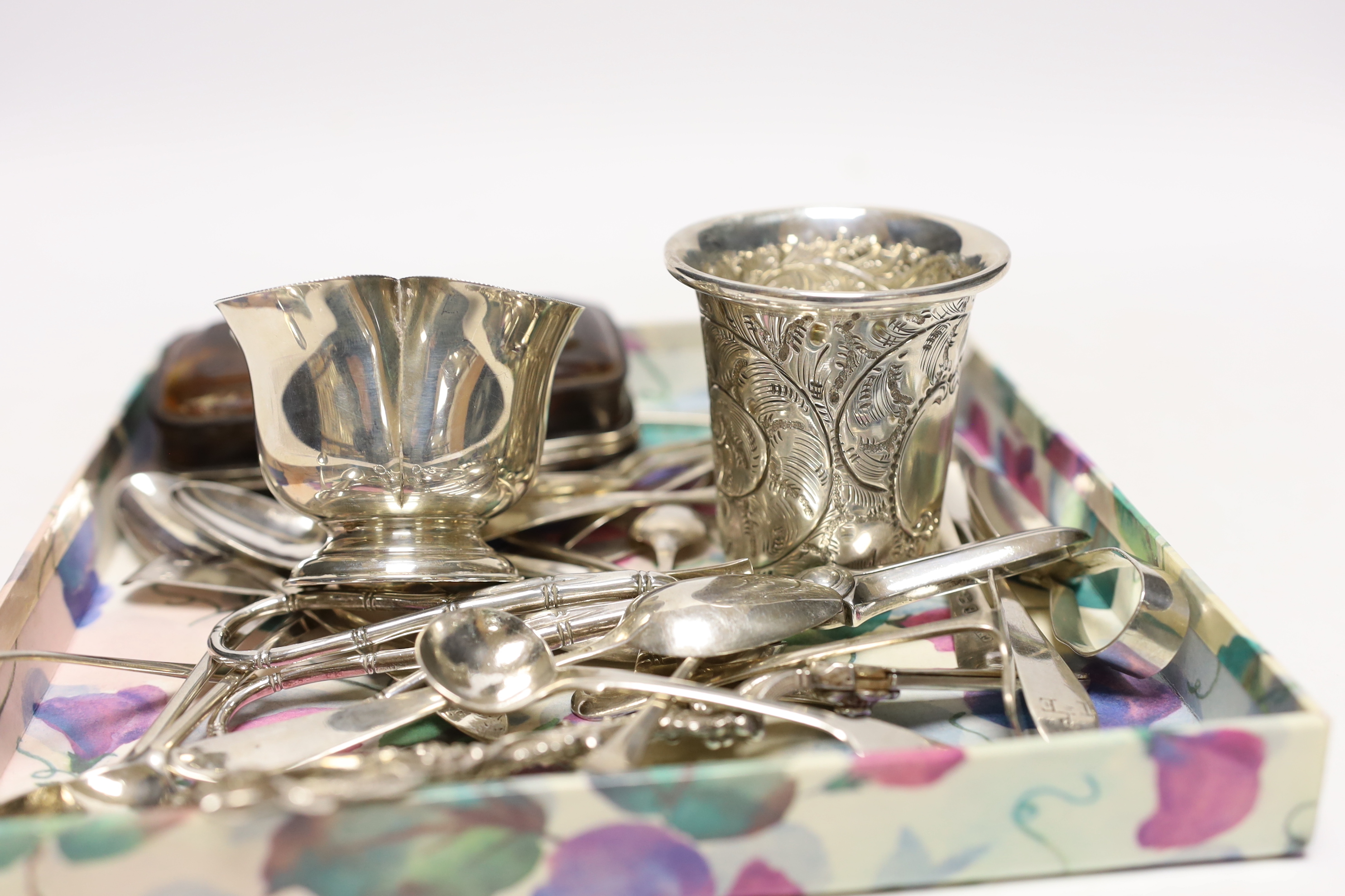 A modern pair of silver vineous grape shears, London, 1977, 16.4cm, one other earlier pair, a sterling beaker, silver bowl and a quantity of assorted silver spoons including 18th century Irish and a pair of preserve spoo